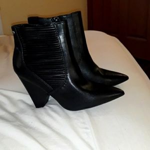 Heel boots black strapped on sides